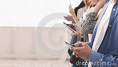 Technology addiction. Teenagers using smartphones, free space Stock Photo