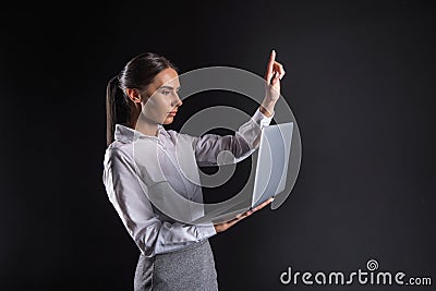 Serious nice businesswoman using sensory screen Stock Photo