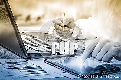 Technology and internet concept - businessman holds the php button on virtual screens Stock Photo