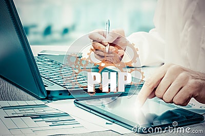 Technology and internet concept - businessman holds the php button on virtual screens Stock Photo