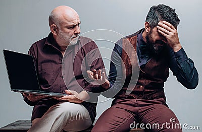 Technology learning, son teaching senior dad. Adult learning. Old and Young. New technology, oldness and lifestyle Stock Photo