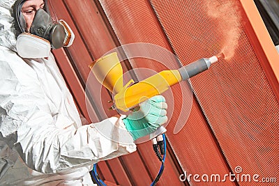 Polymer coating of metal detail with powder spraying gun Stock Photo