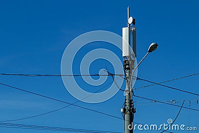 Technology on the top of the telecommunication 4G,LTE GSM tower antenna, transmitter, blue sky. Stock Photo