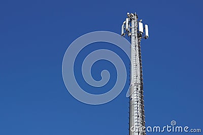 Technology on the top of the telecommunication GSM 4G tower antenna, transmitter , blue sky, white clouds. Stock Photo