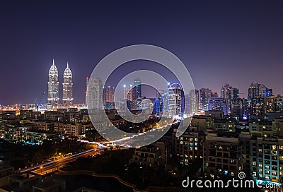 tecom dubai business towers at night lit up Editorial Stock Photo