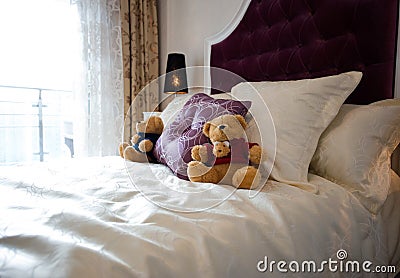 Teddy bear in bed Stock Photo