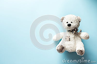 Teddy bear child toy on pastel baby blue background with copy space Stock Photo