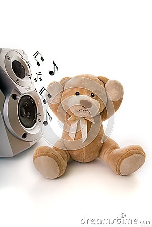 Teddy bear irritated by loud music Stock Photo