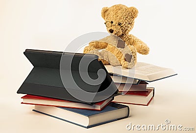 Teddy Bear Reading Digital Media Stock Photo