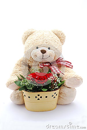 Teddy bear with red roses