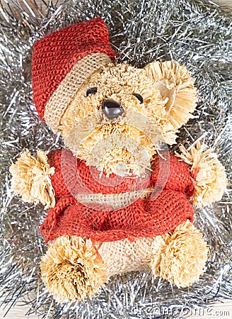 Teddy bear on silvery tinsel Stock Photo