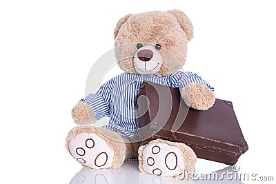 Teddy bear with suitcase isolated on white background - sabbatical or holiday concept Stock Photo