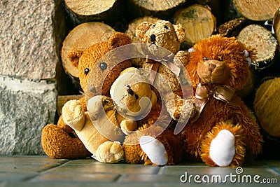 Teddy bears and woodpile Stock Photo