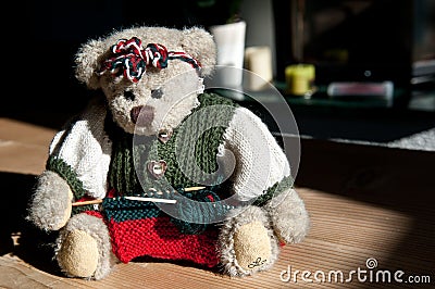 Little knitting girl - Teddy bear Stock Photo