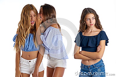 Teen best friends bullying a girl sad apart Stock Photo