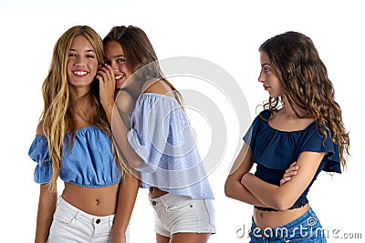 Teen best friends bullying a girl sad apart Stock Photo