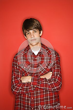 Teen boy with arms crossed. Stock Photo