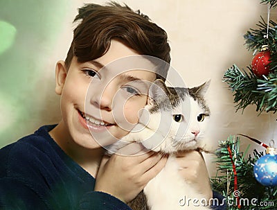 Teen boy with cat hugging Stock Photo