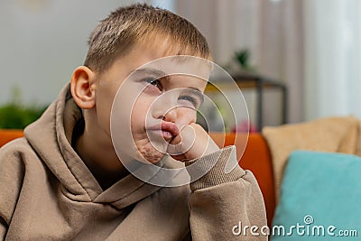 Teen boy at home suffers from unfair situation problem, break up, depressed, feeling bad, burnout Stock Photo