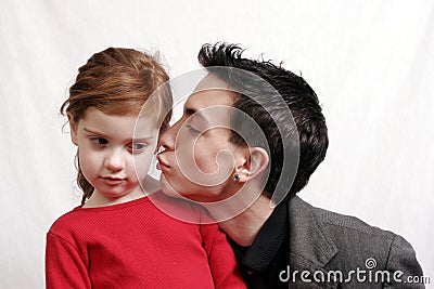 Teen boy kissing little sister Stock Photo