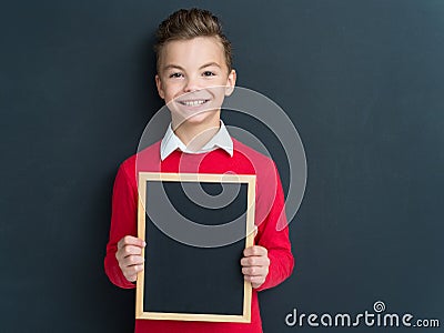 Teen boy with small blackboard Stock Photo