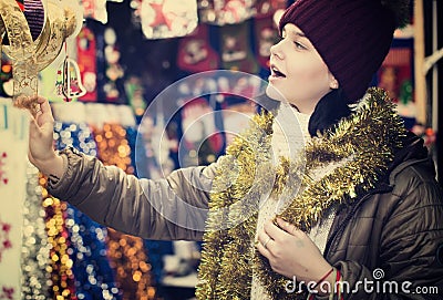 Teen customer near counter with Christmas gifts Stock Photo