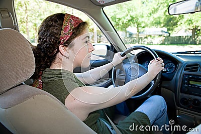 Teen Driver Looks Both Ways Stock Photo