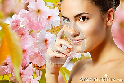 teen girl beautiful cheerful enjoying over spring Japanese cherry tree background Stock Photo