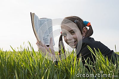 Teen girl with the Bible Stock Photo