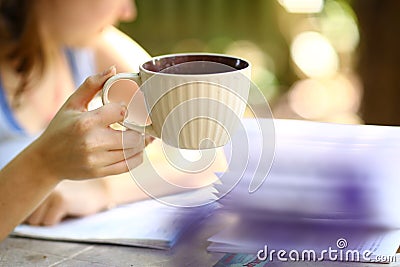 Teen girl with book hold tea cup close up photo Stock Photo