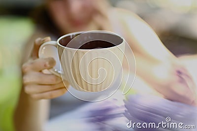 Teen girl with book hold tea cup close up photo Stock Photo