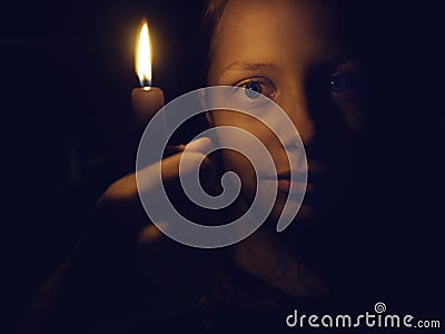Teen girl with a candle Stock Photo