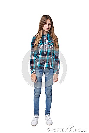 Teen girl in checkered shirt standing casually Stock Photo