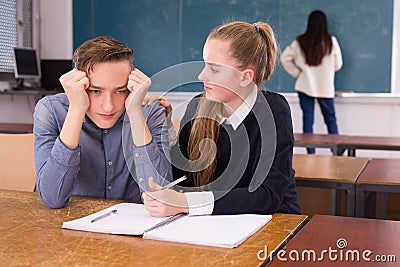 Teen girl comforting sad coursemate Stock Photo