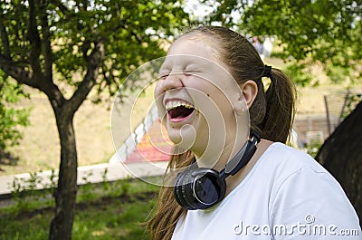 Teen girl explosive emotions. Summer day Stock Photo