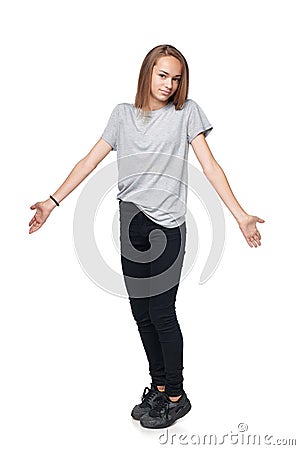 Teen girl in full length shrugging her shoulders Stock Photo