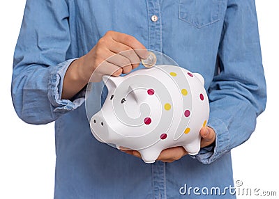 Teen girl holding piggy bank Stock Photo