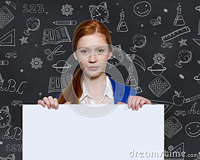 Teen girl holding a sign with copyspace for adverts Stock Photo