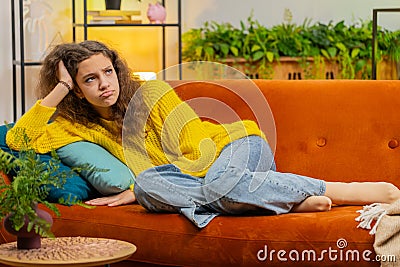 Teen girl at home suffers from unfair situation problem, break up, depressed, feeling bad, burnout Stock Photo