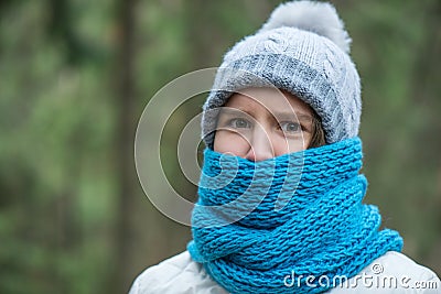 Teen girl lonely standing in the woods or park, sad Stock Photo