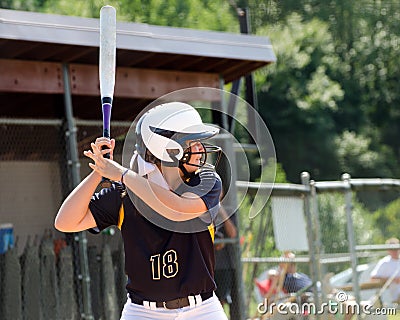 Teen girl playing softball Stock Photo