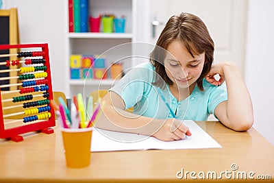 Teen girl practicing and doing homework Stock Photo