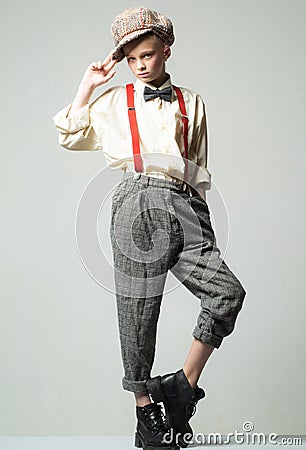 Teen girl in retro male suit. retro fashion model. vintage charleston party. suspender and bow tie. old fashioned child Stock Photo