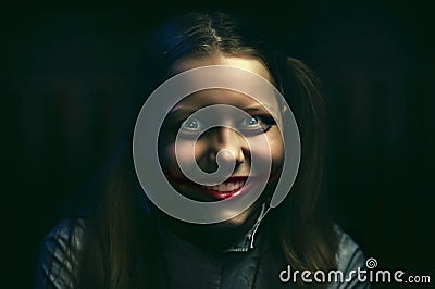 Teen girl with a sinister smile Stock Photo