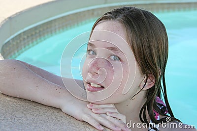 Teen girl swimming Stock Photo
