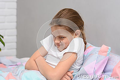 Teen girl ten years old does not want to go to bed Stock Photo