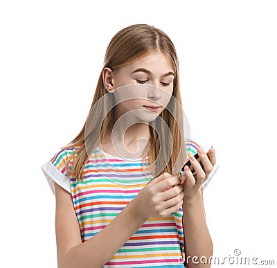 Teen girl using glucometer on white background. Stock Photo