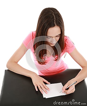 Teen girl writing on note cards Stock Photo