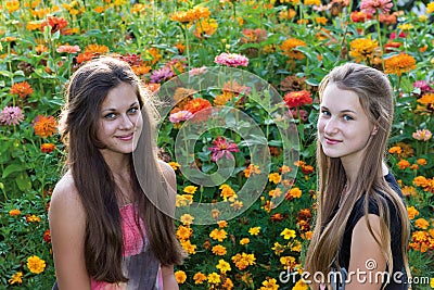 Teen girls on background of flowers Stock Photo