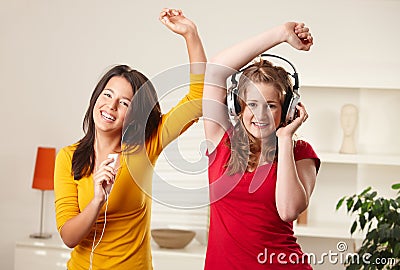 Teen girls listening to music Stock Photo